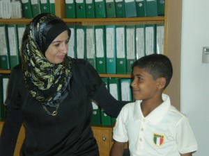 Reem, the director of the Children’s Culturtal Centre talks with Ahmed Somouni, who lost his family to the violence in Gaza.