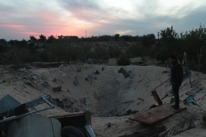 The crater from a bomb that killed one elderly man.