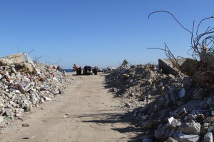 The remains of destroyed buildings are used to increase sea barriers.