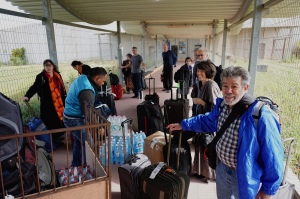 Our group with luggage in the caged walkway going into Gaza (photo By Bob Haynes)